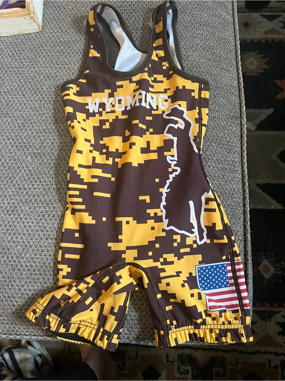 Youth Wyoming Wrestling singlet brown and gold, size youth medium. Like new.